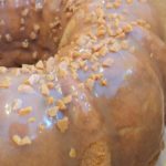 Caramel glazed one bowl cream cake sprinkled with toffee bits
